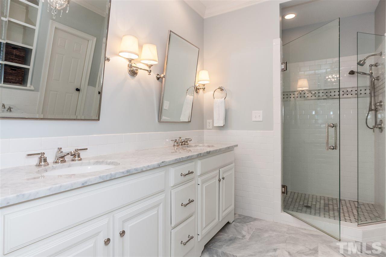 607 Runnymede Road Raleigh, NC 27607 - Photo 13 of 25 a bathroom with a granite countertop sink mirror and double