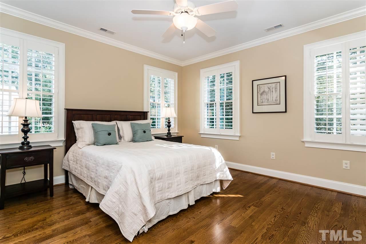607 Runnymede Road Raleigh, NC 27607 - Photo 17 of 25 a bedroom with a bed and a window