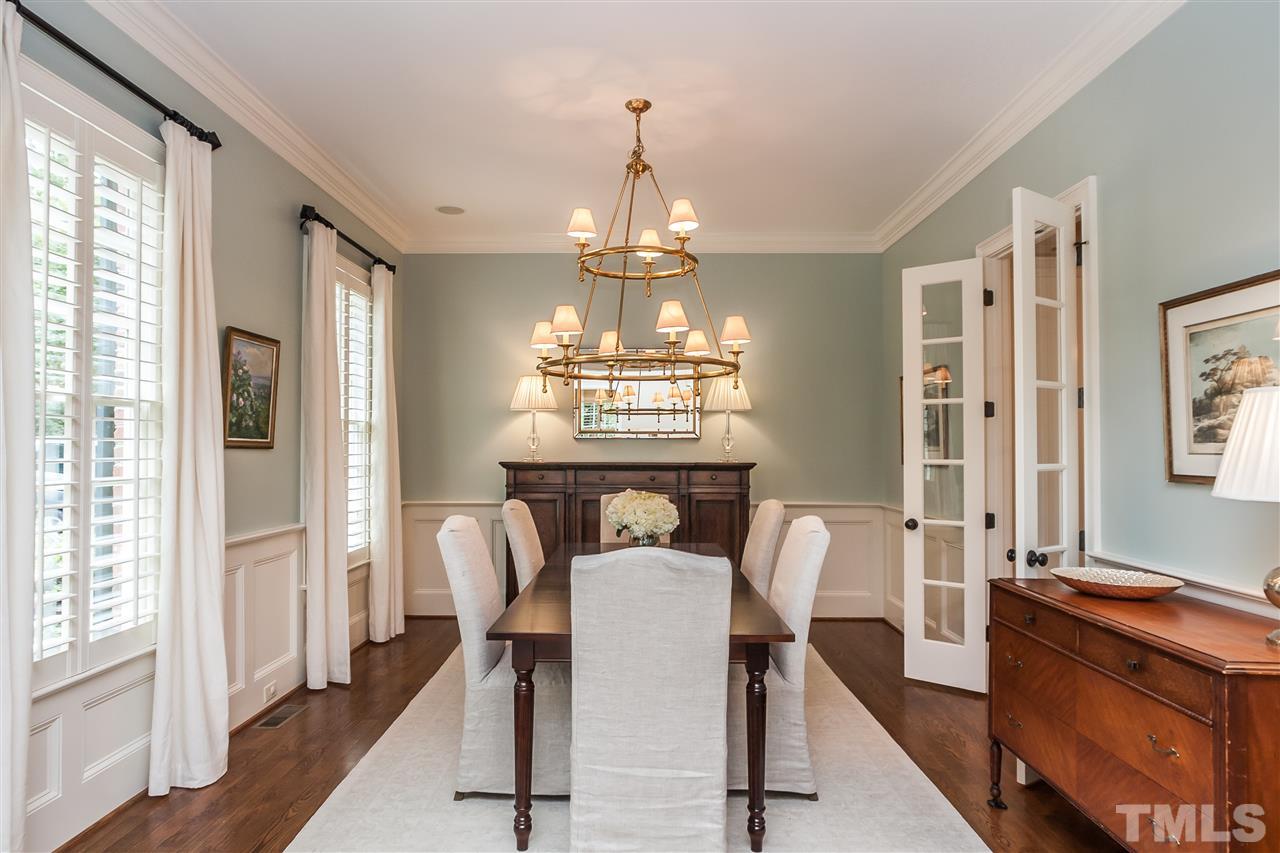 607 Runnymede Road Raleigh, NC 27607 - Photo 3 of 25 a view of a dining room with furniture and windows