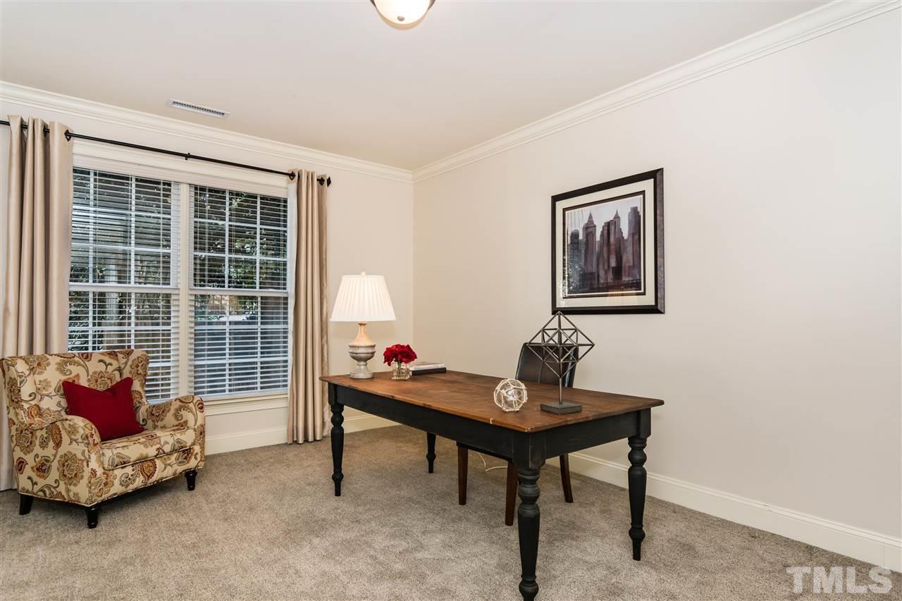 607 Runnymede Road Raleigh, NC 27607 - Photo 21 of 25 a living room with furniture and a window