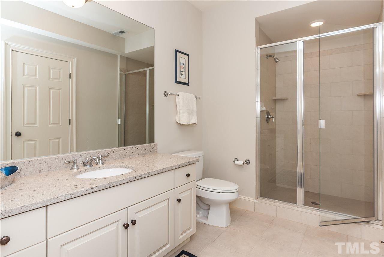 607 Runnymede Road Raleigh, NC 27607 - Photo 22 of 25 a bathroom with a granite countertop sink toilet and shower