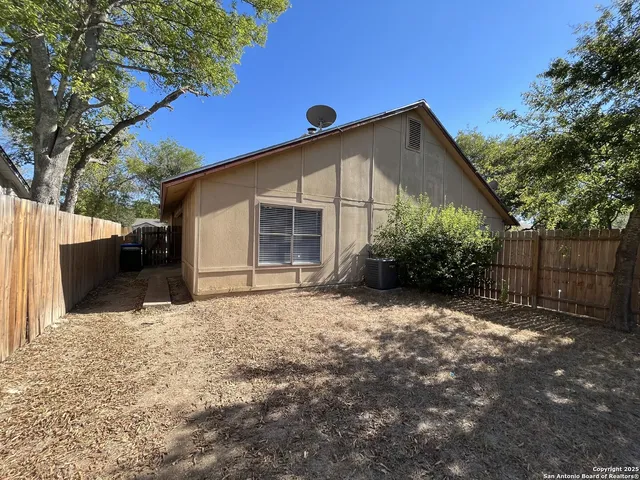 a view of a porch with a hanging chair