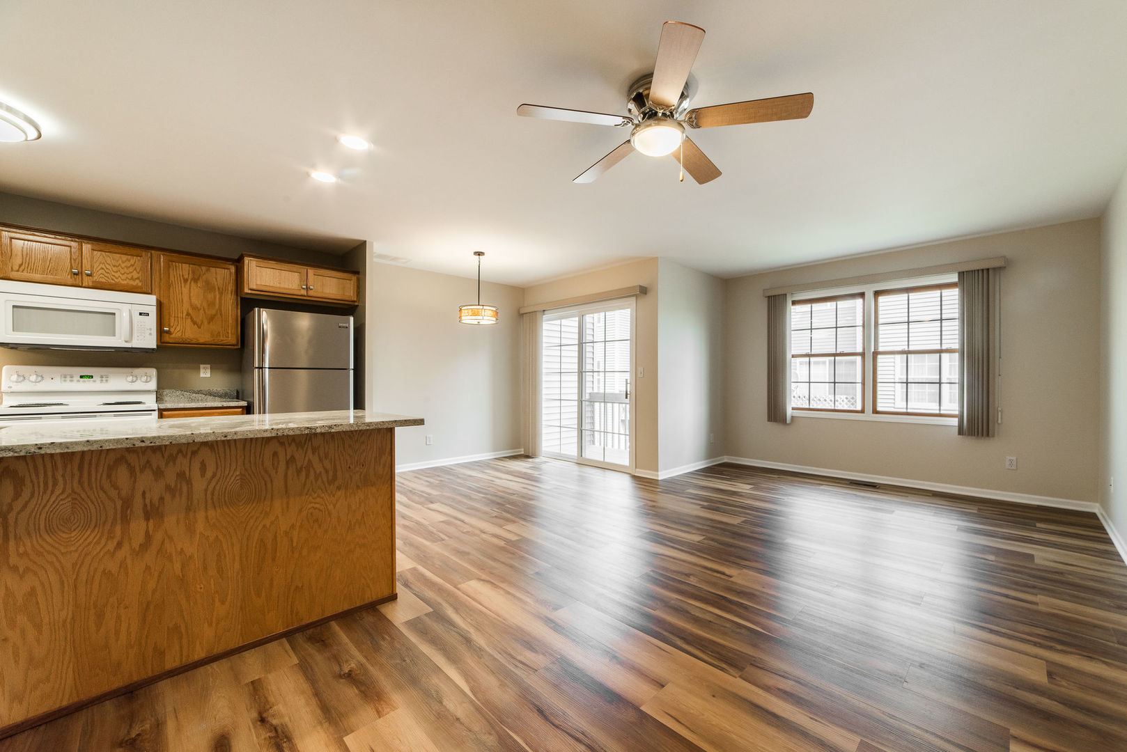 630 South Peace Road Sycamore, IL 60178 - Photo 4 of 21 wooden floor in an empty room with a window