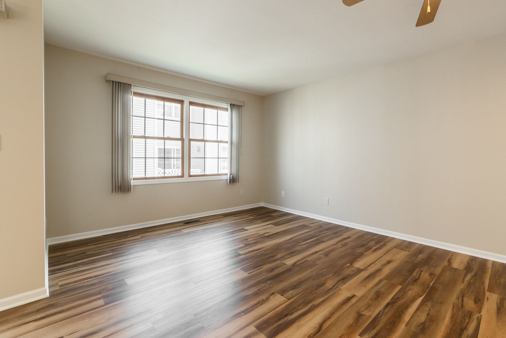 630 South Peace Road Sycamore, IL 60178 - Photo 7 of 21 an empty room with wooden floor and windows
