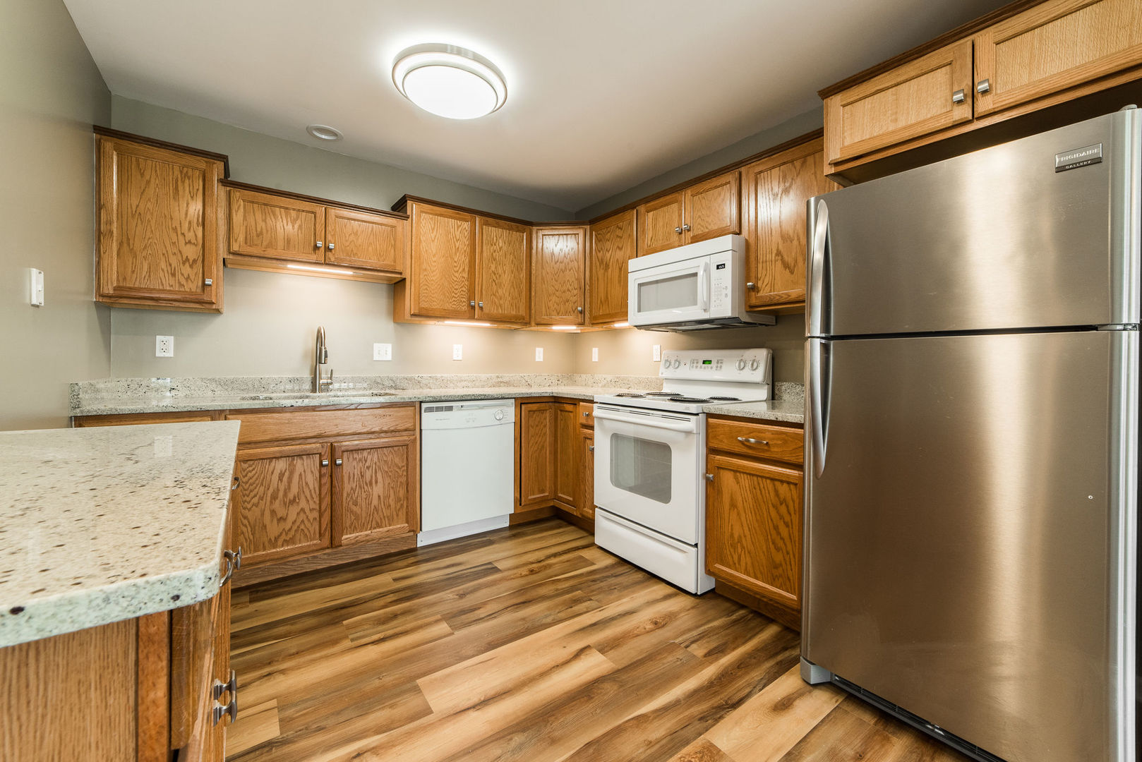 630 South Peace Road Sycamore, IL 60178 - Photo 8 of 21 a kitchen with a refrigerator a sink stainless steel appliances and cabinets
