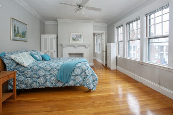 70 Abbottsford Road, Unit 2 Brookline, MA 02446 - Photo 3 of 13 a spacious bedroom with a bed and a window