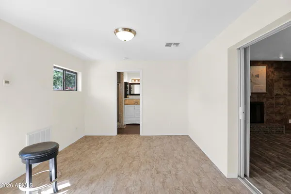 a bathroom with a granite countertop sink a toilet and shower