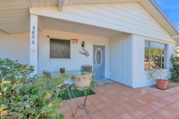 front view of a house with a yard