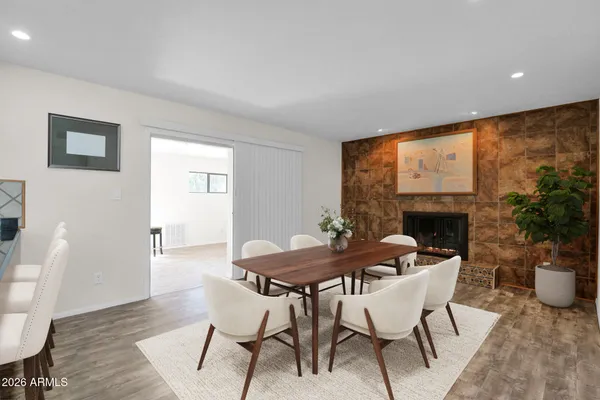 a view of an empty room with a fireplace