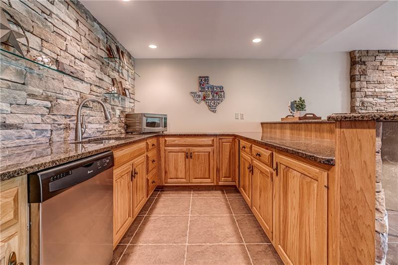 1460 Hollow Tree Drive Pittsburgh, PA 15241 - Photo 21 of 25 Basement kitchenette equipped with dishwasher, sink and microwave.