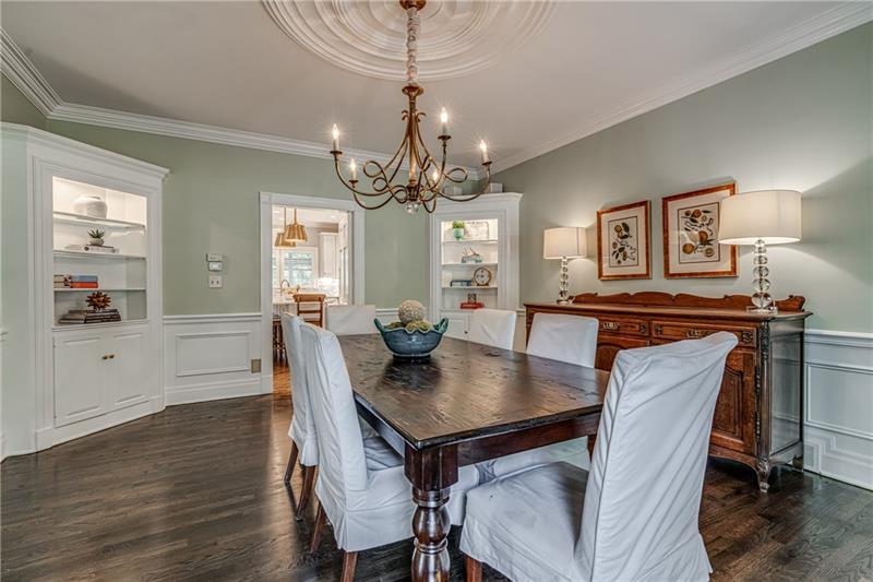 1460 Hollow Tree Drive Pittsburgh, PA 15241 - Photo 8 of 25 Elegant dining room with built in bookcases to the left of the front door. Beautiful wood trim and wainscoting throughout the room.