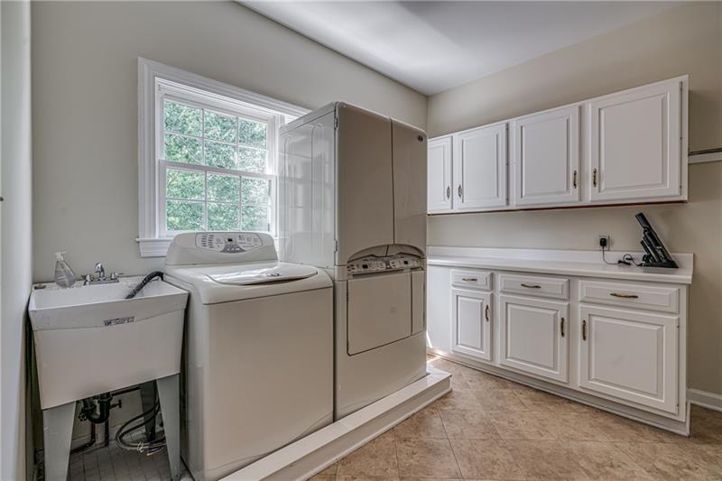1460 Hollow Tree Drive Pittsburgh, PA 15241 - Photo 10 of 25 Conveniently located first floor laundry room behind the hall in kitchen. Lots of cabinet space for use.