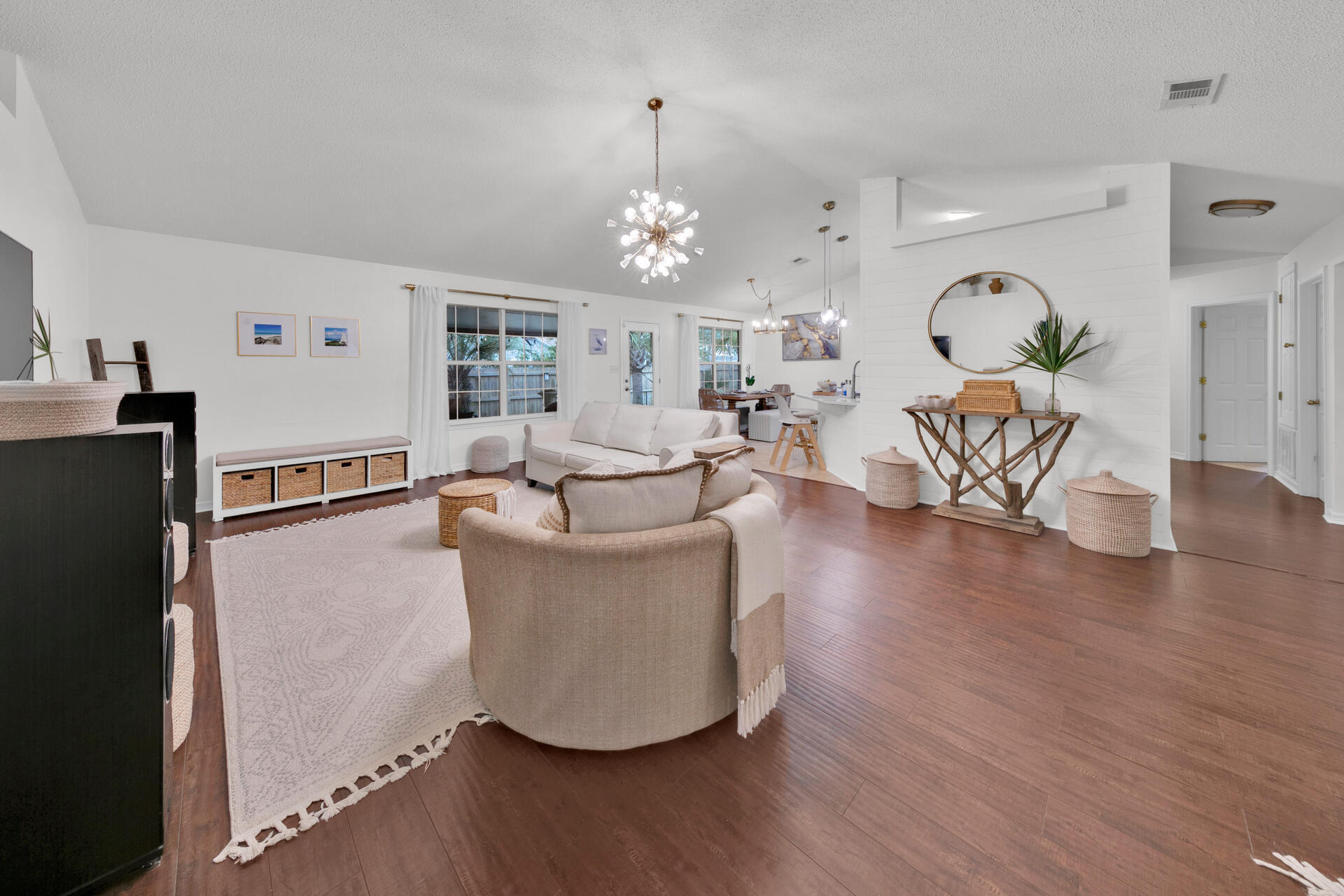 96 Beacon Way Santa Rosa Beach, FL 32459 - Photo 10 of 48 a living room with fireplace furniture and a chandelier