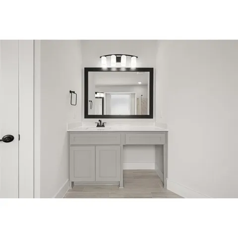 a large kitchen with kitchen island a sink stainless steel appliances and cabinets