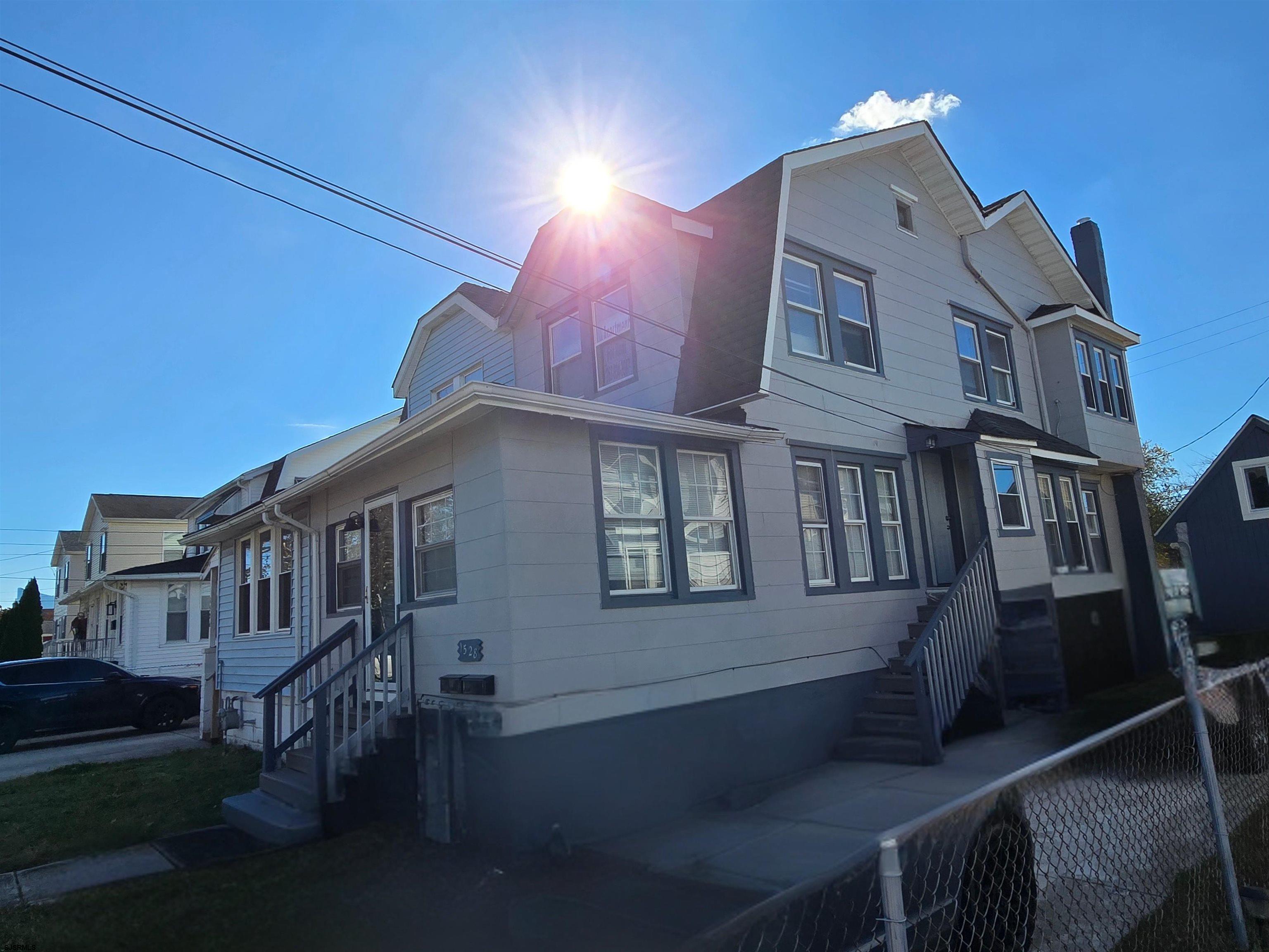 1528 Madison Avenue, Unit B Atlantic City, NJ 08401 - Photo 2 of 12 a front view of a house with a yard