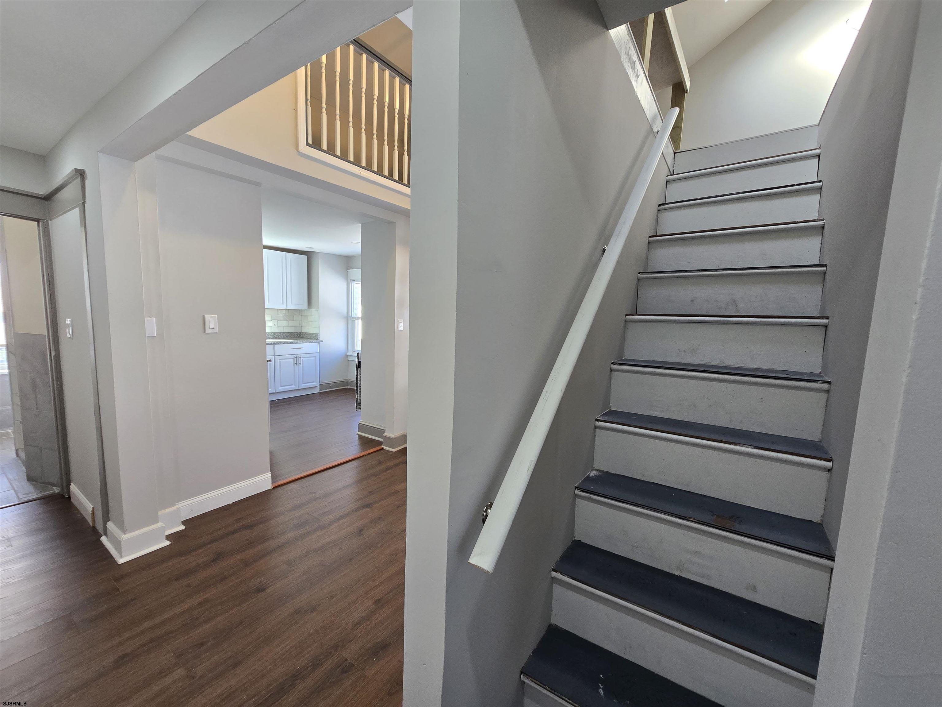 1528 Madison Avenue, Unit B Atlantic City, NJ 08401 - Photo 5 of 12 a view of entryway with wooden floor and stairs