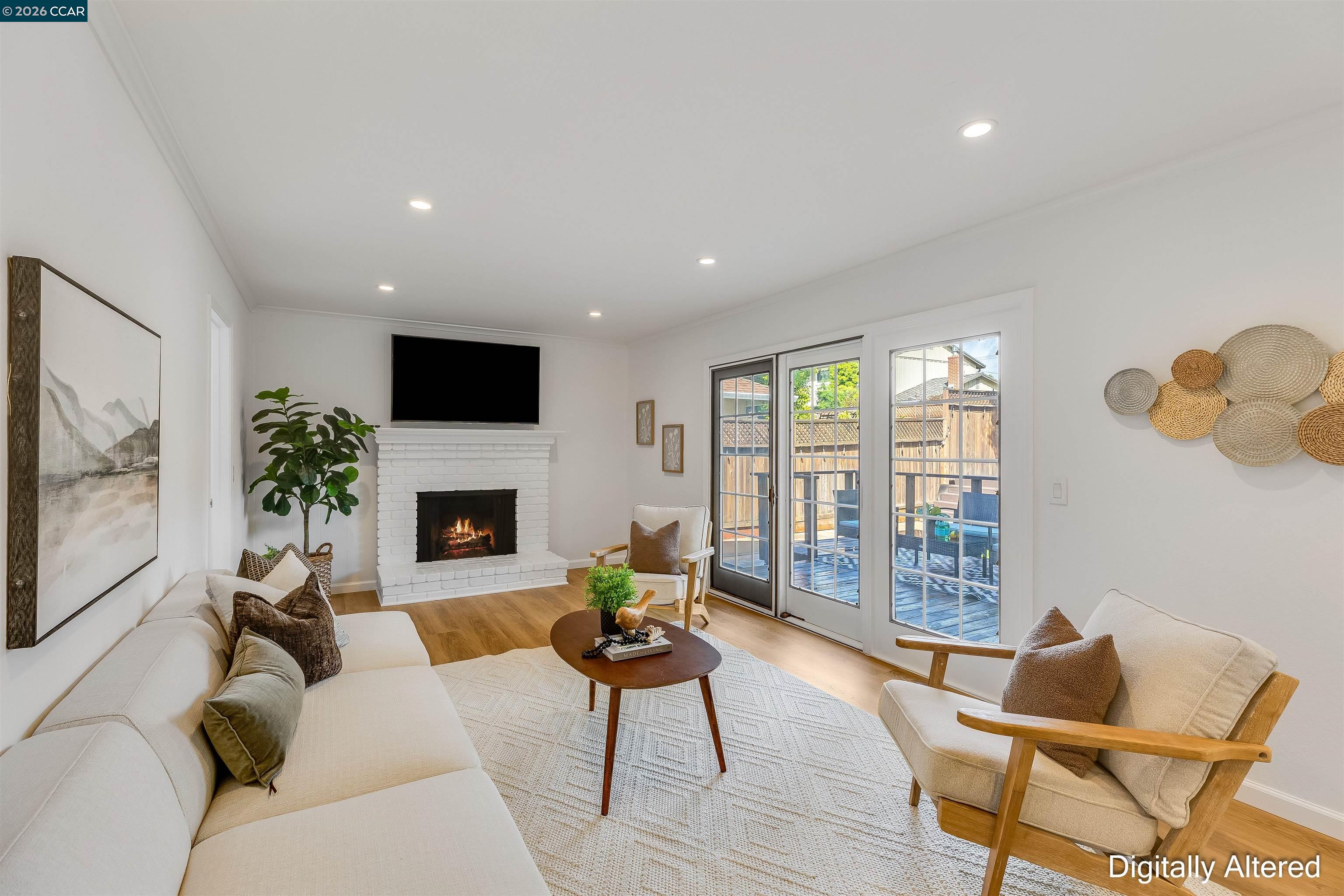 418 Devon Court San Ramon, CA 94583 - Photo 18 of 62 a living room with furniture a fireplace and a flat screen tv