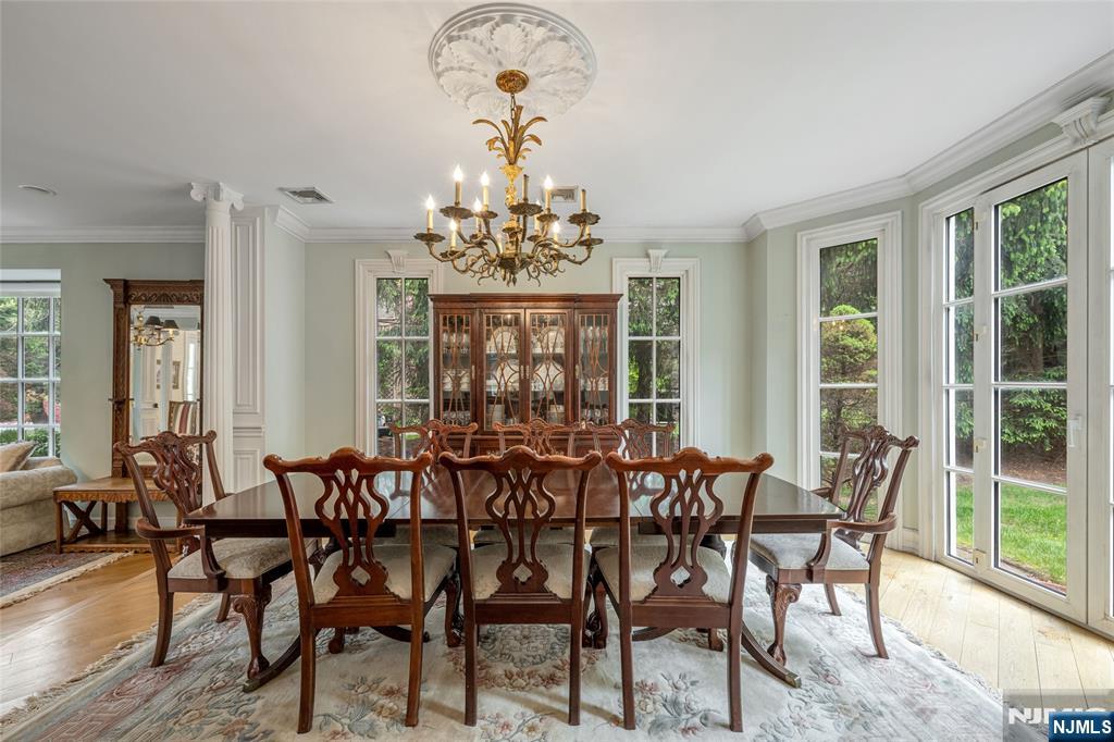 4 Hetzel Drive Mahwah, NJ 07430 - Photo 11 of 29 a view of a dining room with furniture wooden floor and chandelier