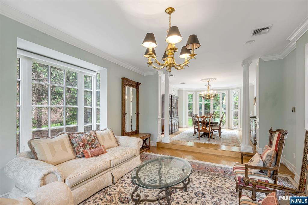 4 Hetzel Drive Mahwah, NJ 07430 - Photo 12 of 29 a living room with furniture chandelier and a large window