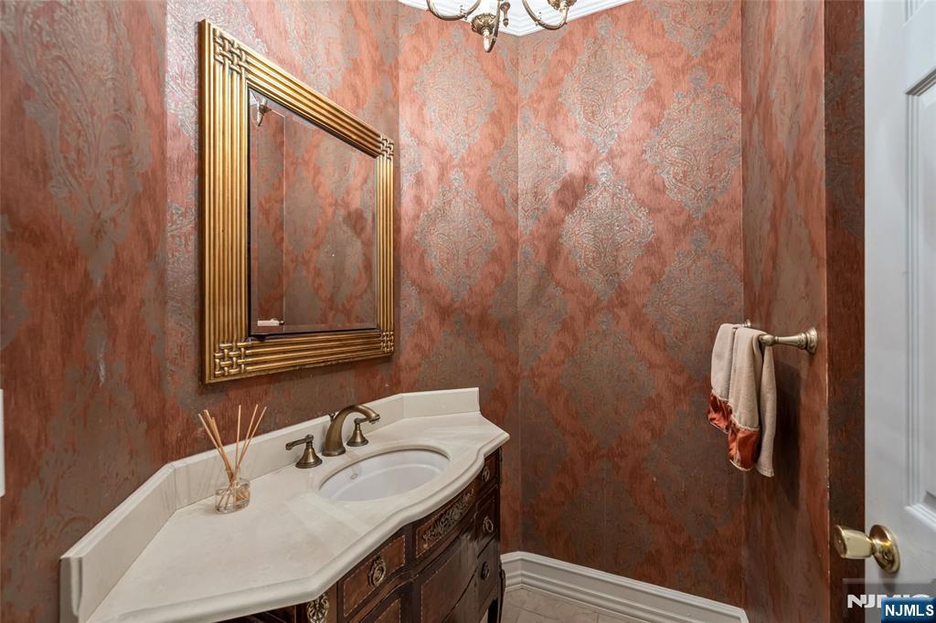 4 Hetzel Drive Mahwah, NJ 07430 - Photo 15 of 29 a bathroom with a sink a toilet and shower