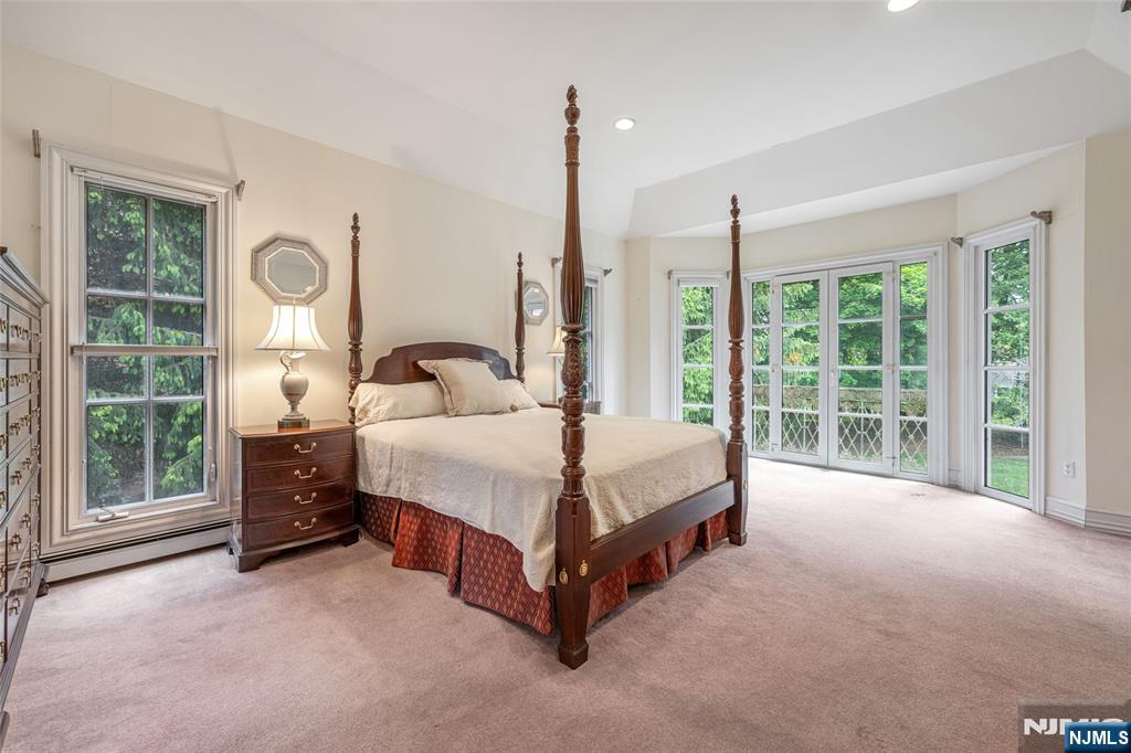 4 Hetzel Drive Mahwah, NJ 07430 - Photo 17 of 29 a bedroom with a bed lamp and window