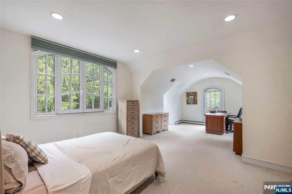 4 Hetzel Drive Mahwah, NJ 07430 - Photo 23 of 29 a bedroom with a bed and a large window