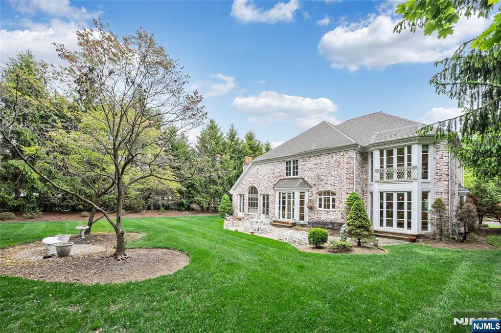 4 Hetzel Drive Mahwah, NJ 07430 - Photo 26 of 29 a view of an house with backyard and a garden