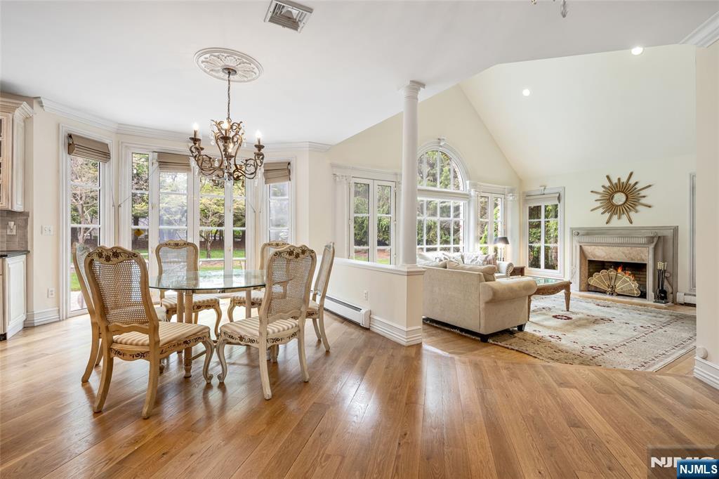 4 Hetzel Drive Mahwah, NJ 07430 - Photo 3 of 29 a view of a dining room with furniture a chandelier and wooden floor
