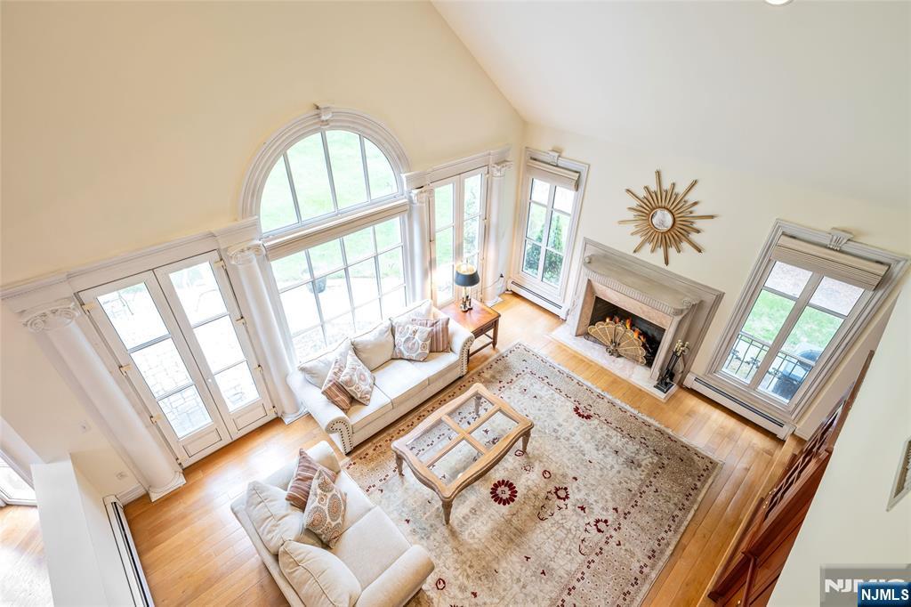4 Hetzel Drive Mahwah, NJ 07430 - Photo 5 of 29 a living room with furniture and a fireplace