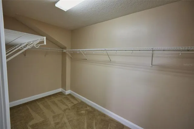 a bathroom with a tub a sink and mirror