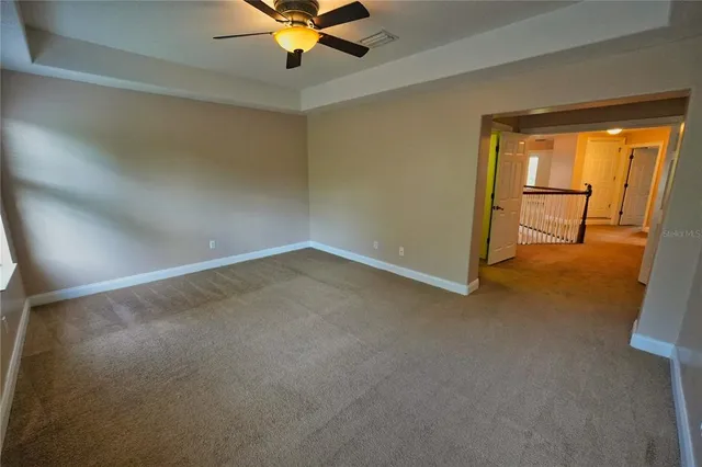 a bathroom with a double vanity sink a mirror and a bathtub