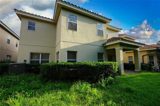 a kitchen with stainless steel appliances granite countertop a stove top oven a sink and a refrigerator