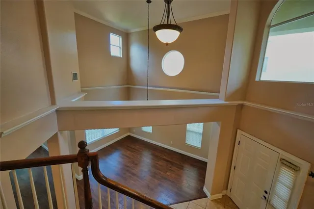 a view of a hallway with entryway to a bedroom