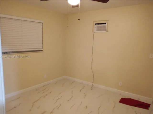 a white toilet sitting next to a white sink