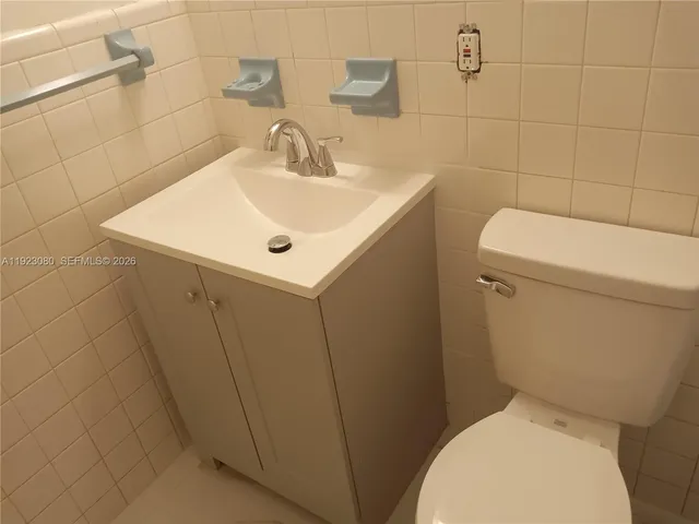 a bathroom with a toilet and bathtub