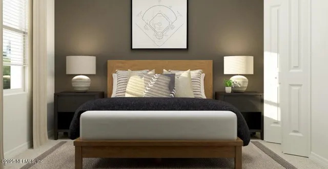 a bedroom with bed and a window