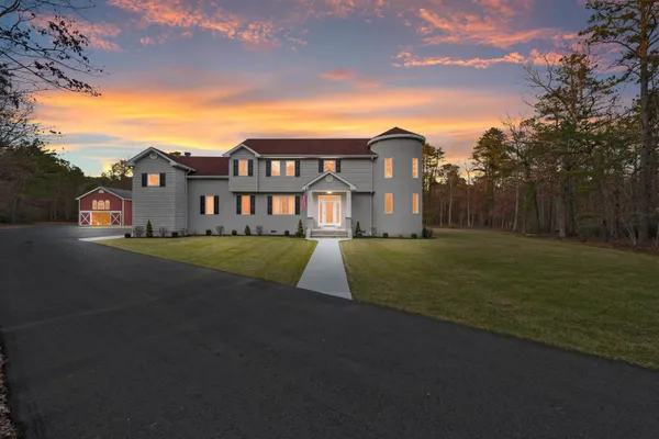 a view of a big house with a big yard