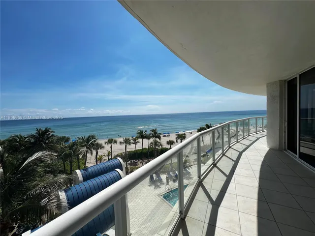 a view of swimming pool with seating area and furniture