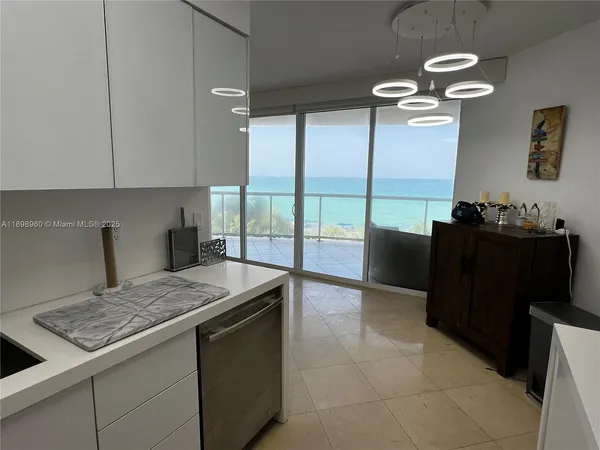 a kitchen with a stove and cabinets