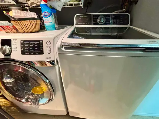a utility room with washer and dryer