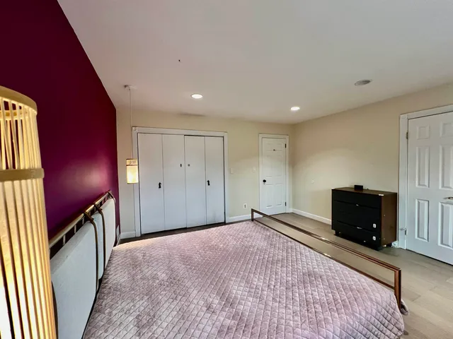 a view of an empty room and a window