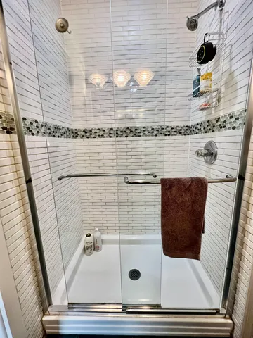 a bathroom with a sink and a shower