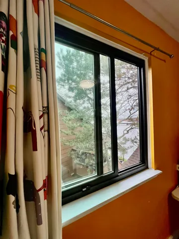 a view of a balcony with wooden floor and outdoor space