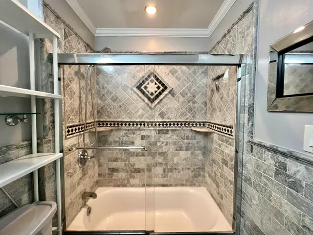 a bathroom with a shower and a bathtub