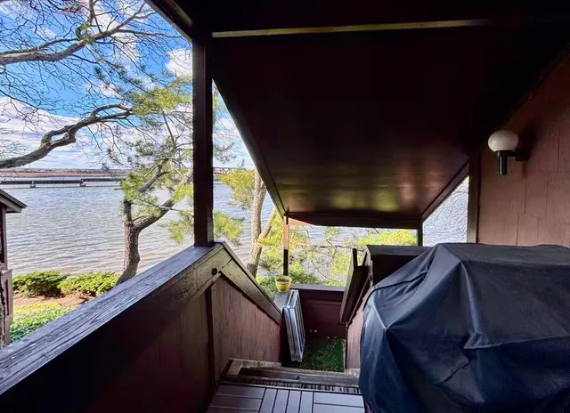 a view of balcony with furniture