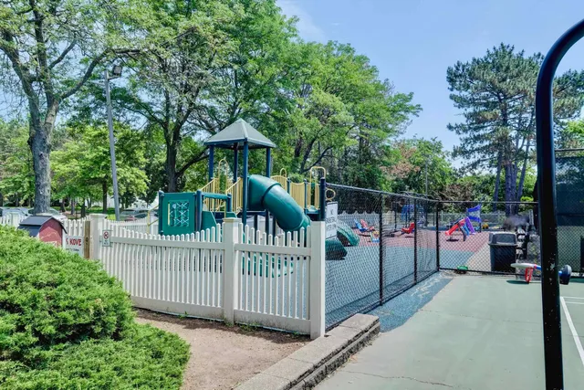 a view of a fence and trees