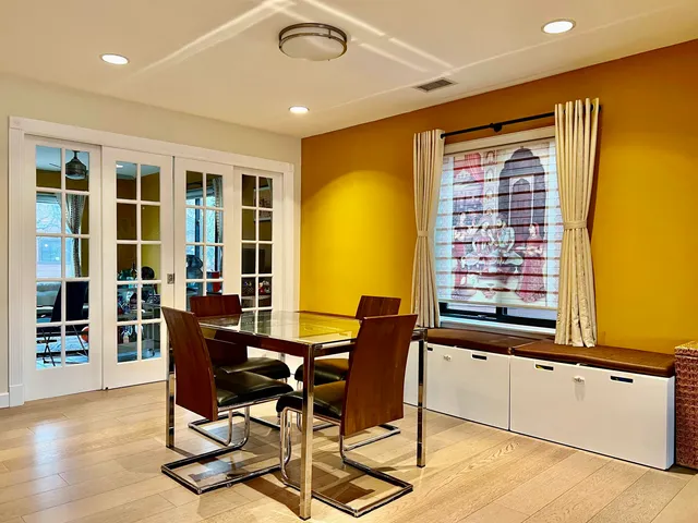 a view of a dining room with furniture and window