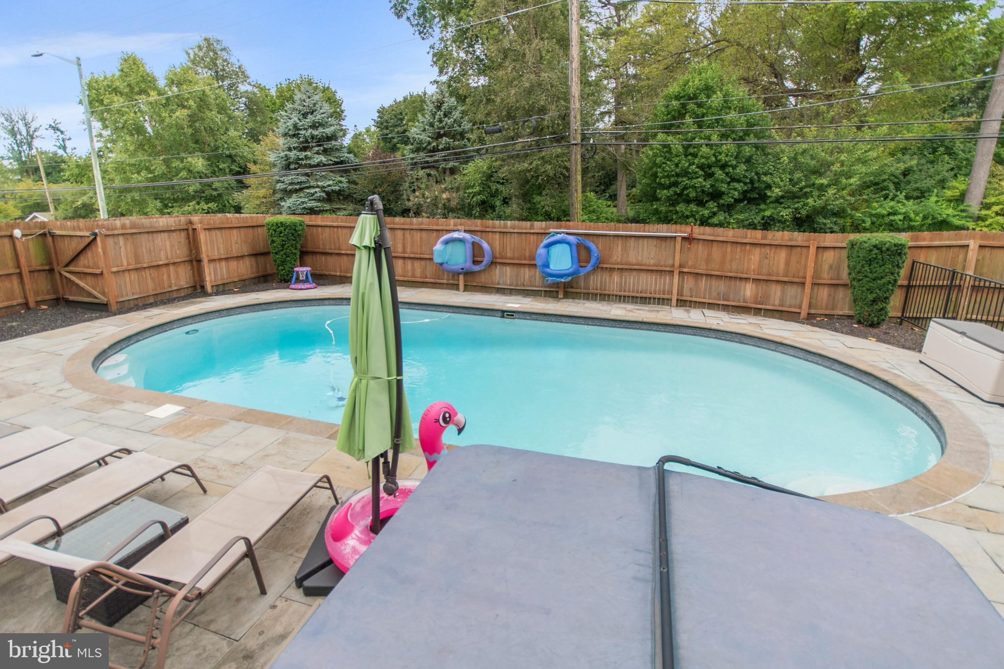 7902 Rambler Road Elkins Park, PA 19027 - Photo 37 of 41 Heated pool with large flagstone decking