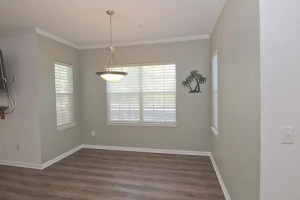 a view of a room with wooden floor and staircase