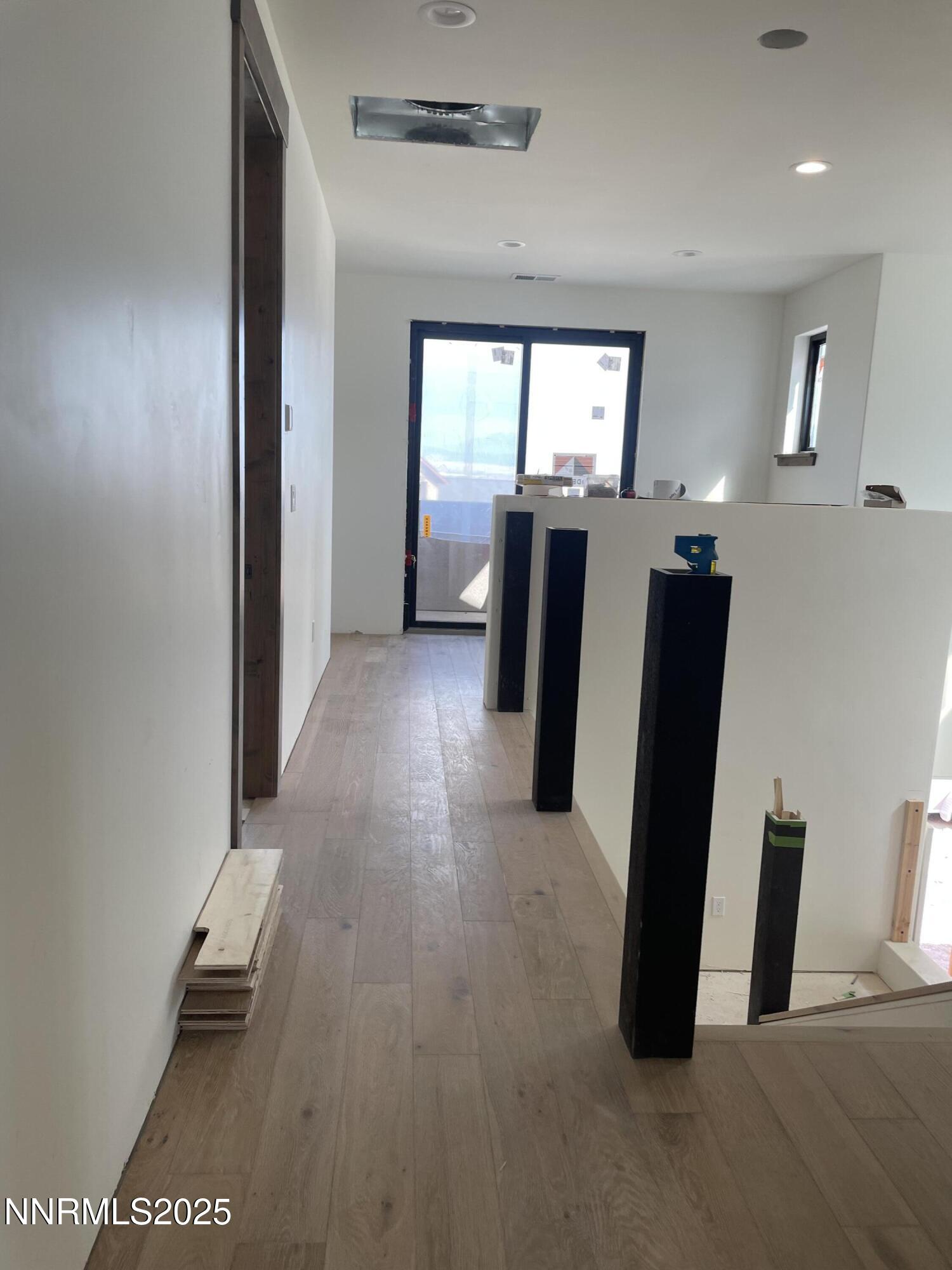 456 Tralee Lane Genoa, NV 89411 - Photo 13 of 16 a view of a hallway with furniture and front door